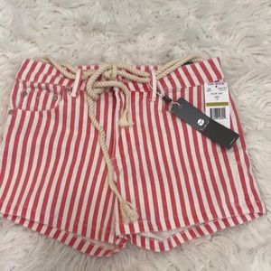 Pink/red and white striped mid rise jean shorts, tie at the top, have pockets